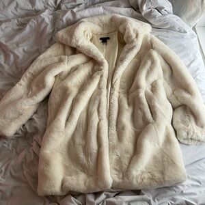 White faux fur coat